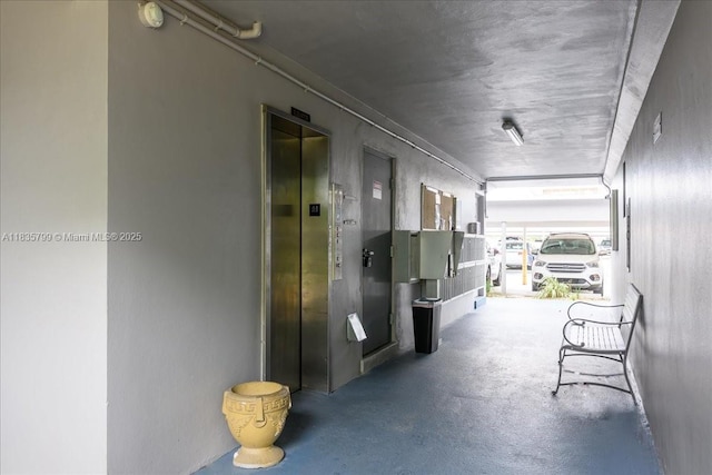 1200 SW 12th St Unit 214, Fort Lauderdale, FL 33315 - hall featuring elevator and concrete flooring