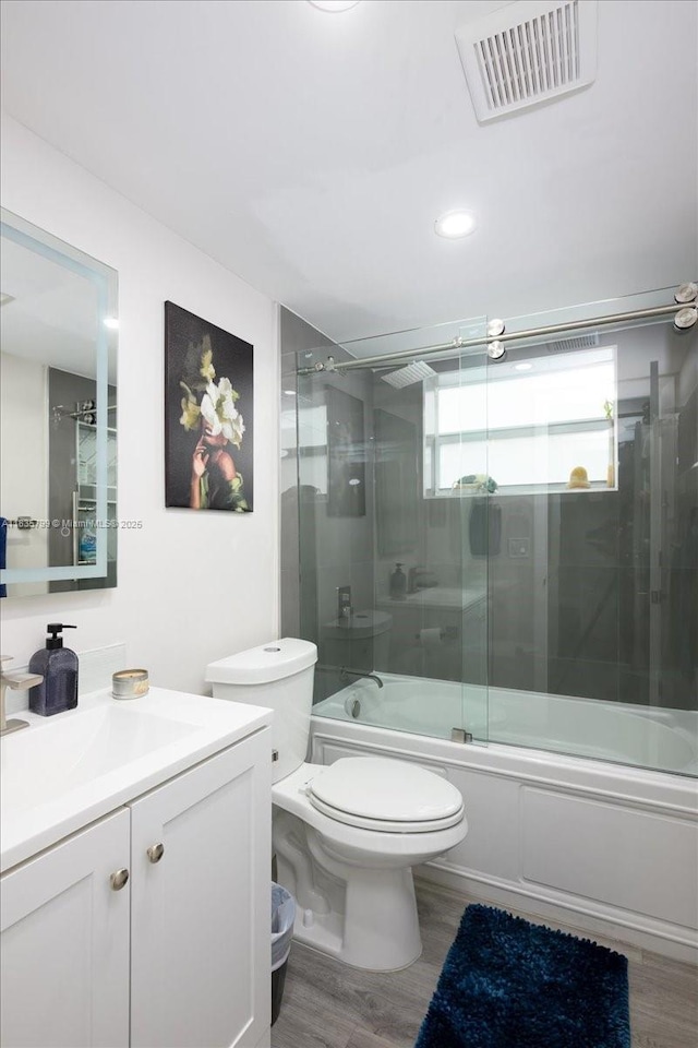 1200 SW 12th St Unit 214, Fort Lauderdale, FL 33315 - full bathroom featuring vanity, shower / bath combination with glass door, wood finished floors, and recessed lighting