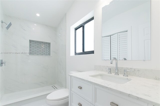 1896 NW 66th St, Miami, FL 33147 - bathroom featuring vanity, a marble finish shower, and recessed lighting