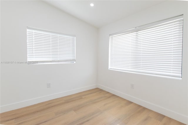 1896 NW 66th St, Miami, FL 33147 - spare room featuring light wood-type flooring, lofted ceiling, and recessed lighting