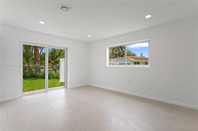 1710 SW 1st Ave, Pompano Beach, FL 33060 - spare room featuring plenty of natural light, recessed lighting, and light tile patterned floors