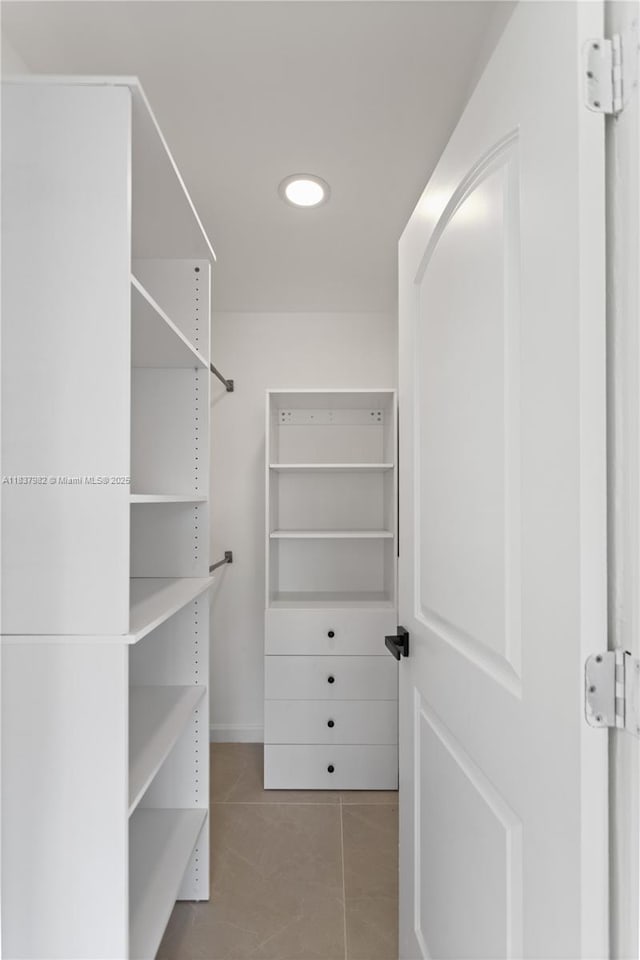 1710 SW 1st Ave, Pompano Beach, FL 33060 - walk in closet featuring tile patterned flooring