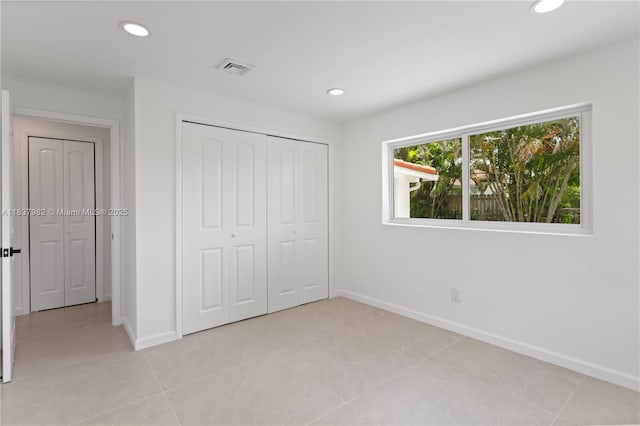 1710 SW 1st Ave, Pompano Beach, FL 33060 - unfurnished bedroom with recessed lighting, a closet, and light tile patterned floors