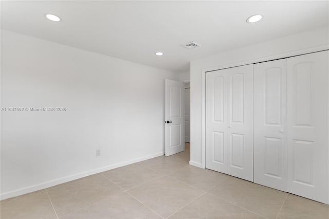 1710 SW 1st Ave, Pompano Beach, FL 33060 - unfurnished bedroom with recessed lighting, a closet, and light tile patterned floors