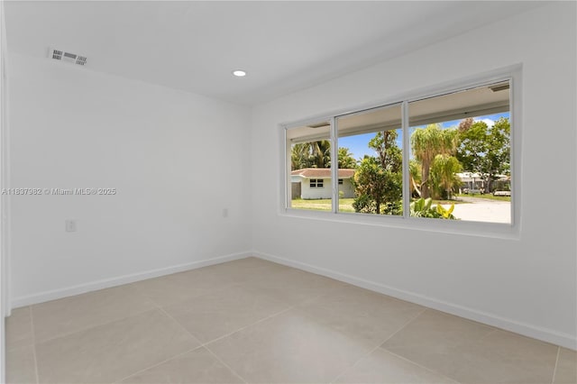 1710 SW 1st Ave, Pompano Beach, FL 33060 - unfurnished room featuring healthy amount of natural light, recessed lighting, and light tile patterned flooring