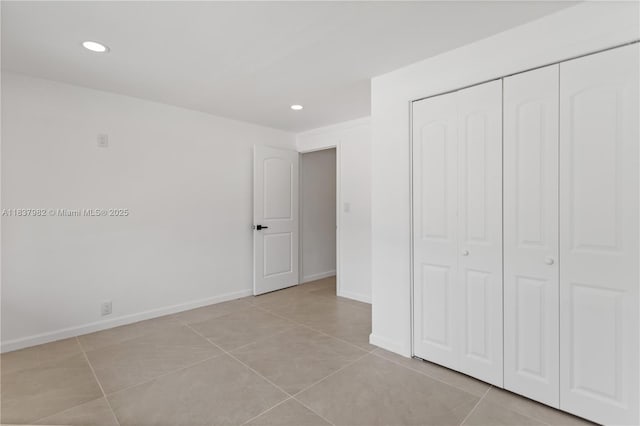 1710 SW 1st Ave, Pompano Beach, FL 33060 - unfurnished bedroom with recessed lighting, a closet, and light tile patterned floors