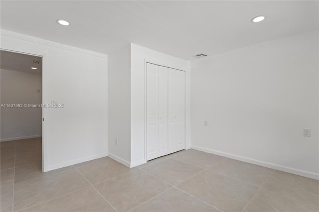 1710 SW 1st Ave, Pompano Beach, FL 33060 - unfurnished bedroom with recessed lighting, a closet, and light tile patterned flooring