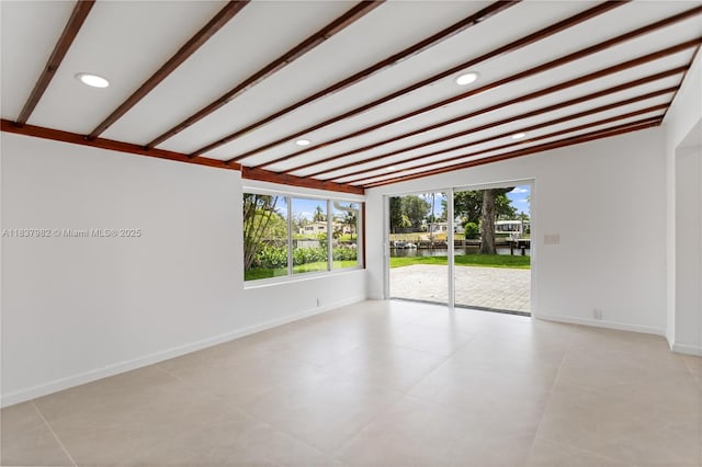 1710 SW 1st Ave, Pompano Beach, FL 33060 - unfurnished room with a water view, recessed lighting, beam ceiling, and light tile patterned flooring