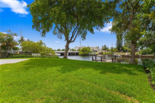 1710 SW 1st Ave, Pompano Beach, FL 33060 - view of green lawn with a water view and a dock