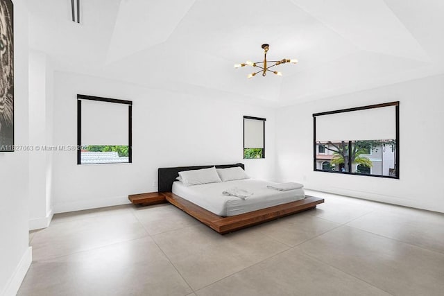 10746 Charleston Pl, Cooper City, FL 33026 - bedroom featuring a chandelier, finished concrete flooring, and a raised ceiling