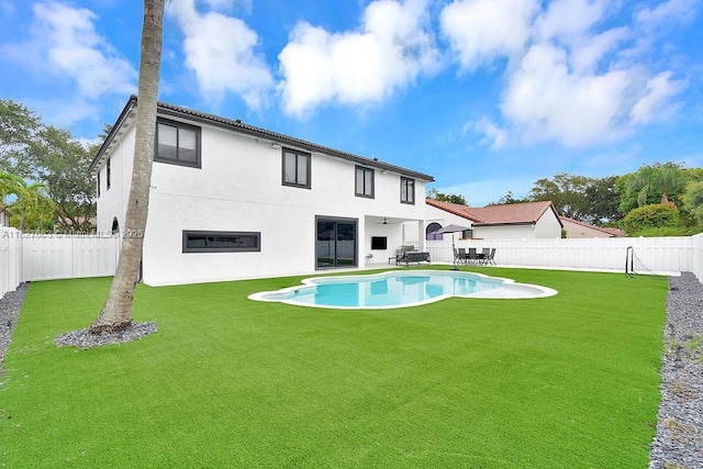 10746 Charleston Pl, Cooper City, FL 33026 - back of house featuring a fenced backyard, stucco siding, and a patio area