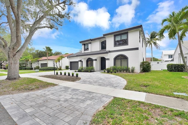 10746 Charleston Pl, Cooper City, FL 33026 - mediterranean / spanish-style house featuring decorative driveway, stucco siding, and a tile roof