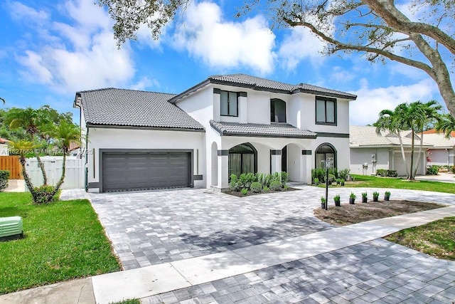 10746 Charleston Pl, Cooper City, FL 33026 - mediterranean / spanish house with a garage, a tiled roof, stucco siding, and decorative driveway