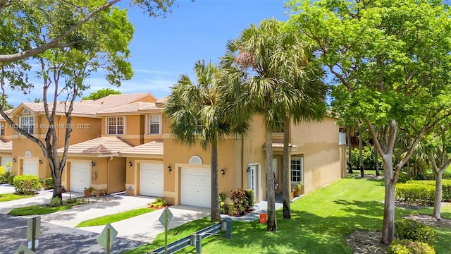 10104 Royal Palm Blvd Unit 107-C, Coral Springs, FL 33065 - multi unit property featuring an attached garage, stucco siding, concrete driveway, a front yard, and a tiled roof