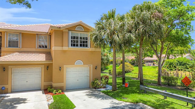 10104 Royal Palm Blvd Unit 107-C, Coral Springs, FL 33065 - view of property with a garage, a tile roof, concrete driveway, stucco siding, and a front lawn