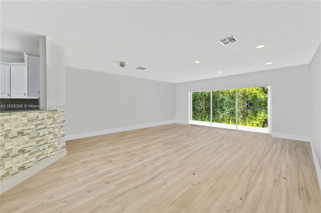 10104 Royal Palm Blvd Unit 107-C, Coral Springs, FL 33065 - unfurnished living room with light wood-type flooring and recessed lighting