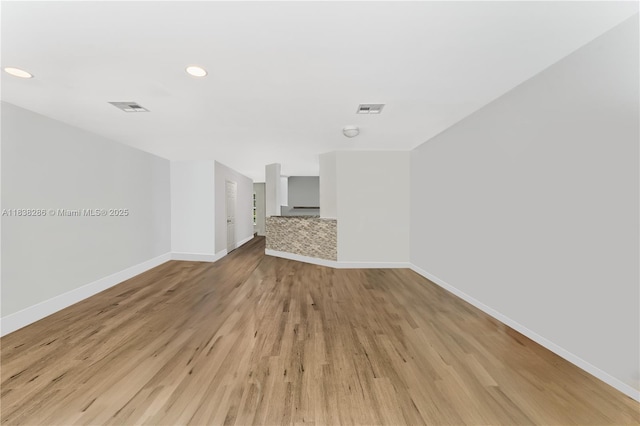 10104 Royal Palm Blvd Unit 107-C, Coral Springs, FL 33065 - unfurnished living room with light wood finished floors and recessed lighting