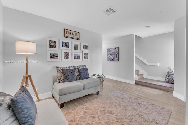 10104 Royal Palm Blvd Unit 107-C, Coral Springs, FL 33065 - living room featuring stairway and wood finished floors