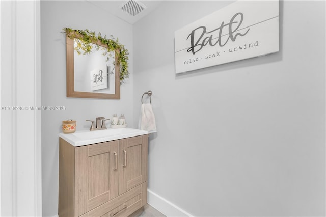 10104 Royal Palm Blvd Unit 107-C, Coral Springs, FL 33065 - bathroom featuring baseboards and vanity