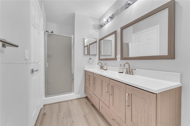 10104 Royal Palm Blvd Unit 107-C, Coral Springs, FL 33065 - full bath featuring a shower stall, wood finished floors, and double vanity