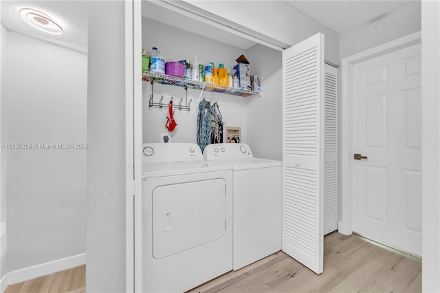 10104 Royal Palm Blvd Unit 107-C, Coral Springs, FL 33065 - laundry area with separate washer and dryer, light wood-type flooring, and a textured ceiling