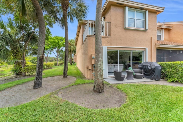 10104 Royal Palm Blvd Unit 107-C, Coral Springs, FL 33065 - rear view of house with stucco siding, a lawn, a balcony, and a patio