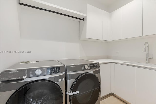 2824 Coconut Ave Unit 2824, Miami, FL 33133 - laundry room featuring washing machine and dryer and cabinet space