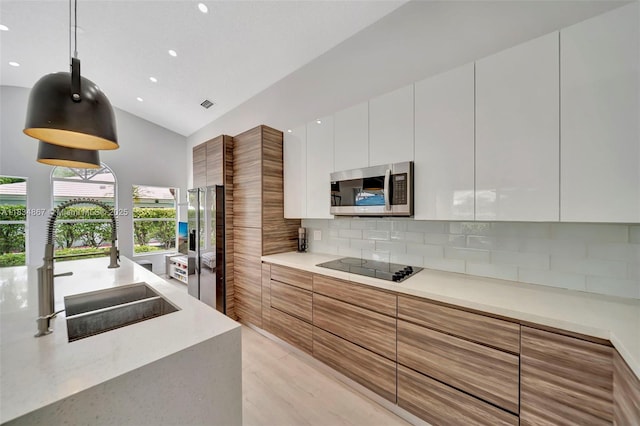 15281 Wilshire Ct, Pembroke Pines, FL 33027 - kitchen featuring stainless steel appliances, modern cabinets, white cabinetry, decorative backsplash, and recessed lighting