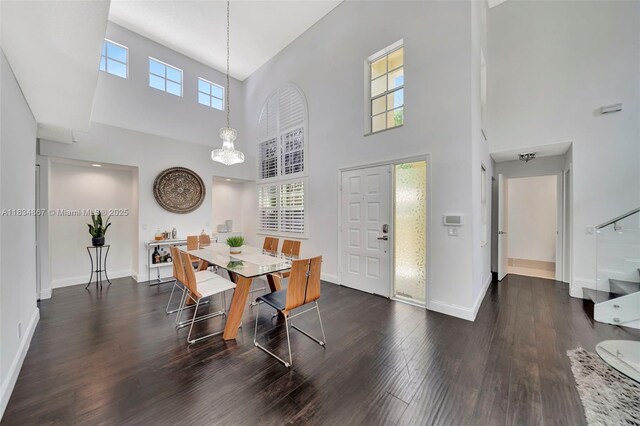 15281 Wilshire Ct, Pembroke Pines, FL 33027 - dining space with a towering ceiling, wood finished floors, and a chandelier