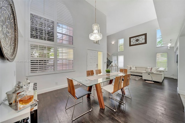 15281 Wilshire Ct, Pembroke Pines, FL 33027 - dining area with high vaulted ceiling, a chandelier, and dark wood finished floors