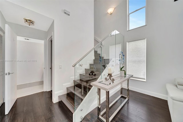 15281 Wilshire Ct, Pembroke Pines, FL 33027 - staircase featuring wood finished floors and a towering ceiling