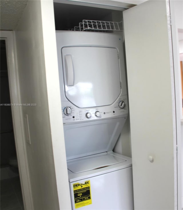 1075 W 68th St Unit 110, Hialeah, FL 33014 - laundry area featuring stacked washing machine and dryer