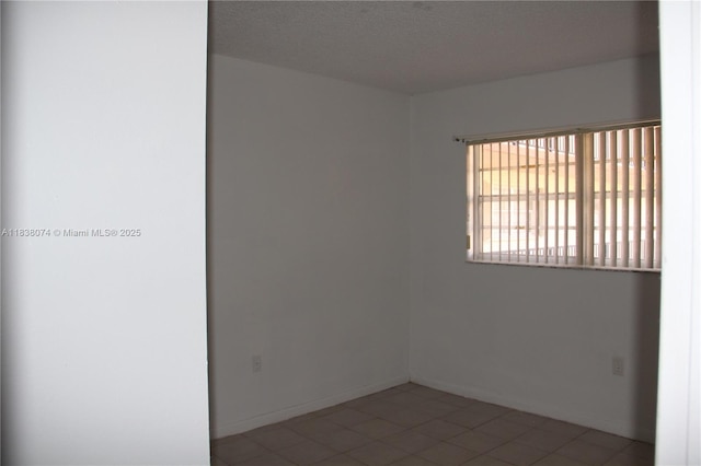 1075 W 68th St Unit 110, Hialeah, FL 33014 - tiled empty room featuring baseboards