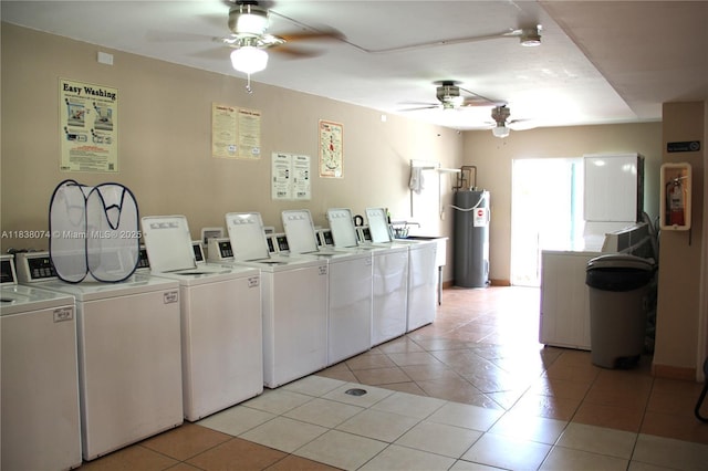 1075 W 68th St Unit 110, Hialeah, FL 33014 - community laundry with washer and dryer, a ceiling fan, water heater, and light tile patterned flooring