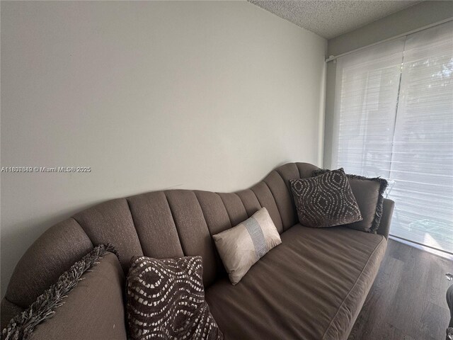4235 N University Dr Unit 312, Sunrise, FL 33351 - living room featuring wood finished floors and a textured ceiling