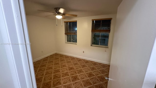 8680 NW 3rd Ln Unit 303, Miami, FL 33126 - spare room with tile patterned floors and a ceiling fan