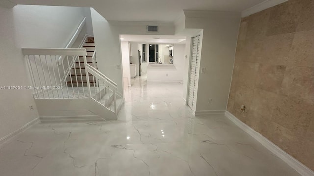 8680 NW 3rd Ln Unit 303, Miami, FL 33126 - hall with stairs, crown molding, and marble finish floors