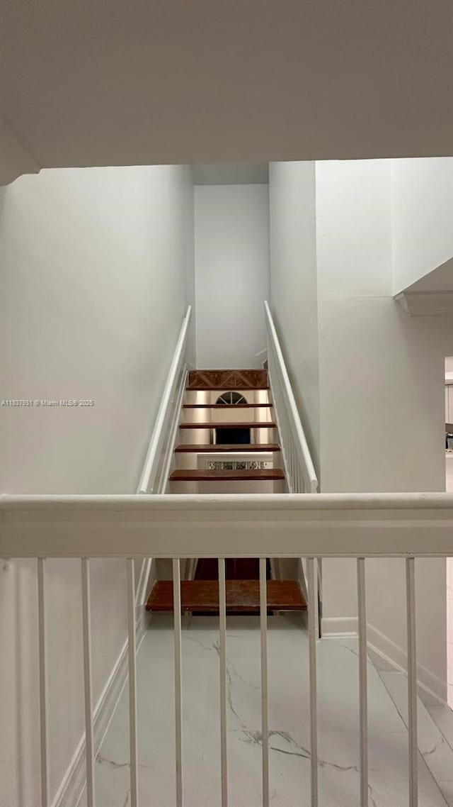 8680 NW 3rd Ln Unit 303, Miami, FL 33126 - stairway featuring marble finish flooring