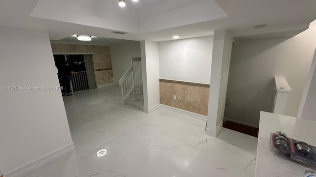 8680 NW 3rd Ln Unit 303, Miami, FL 33126 - basement featuring marble finish flooring, stairs, and wainscoting