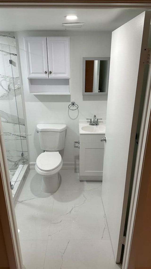 8680 NW 3rd Ln Unit 303, Miami, FL 33126 - bathroom with marble finish floors, a marble finish shower, and vanity
