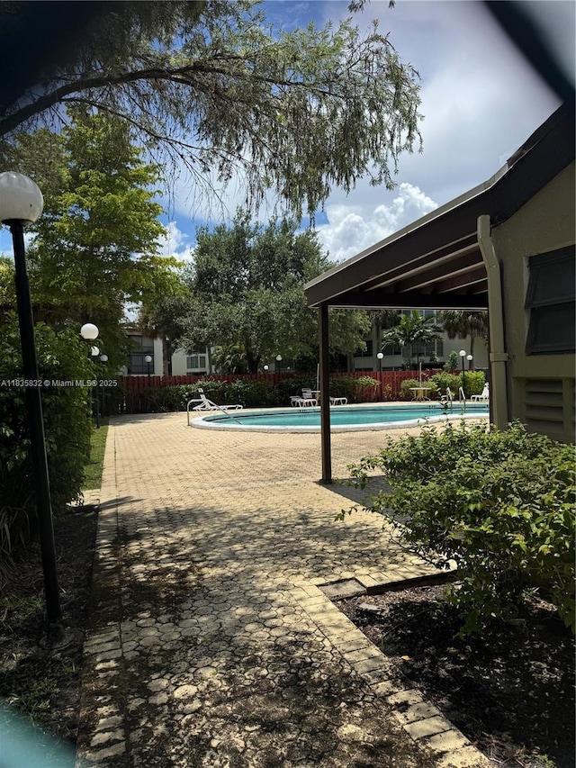 7480 NW 17th St Unit 103, Plantation, FL 33313 - community pool with a patio area