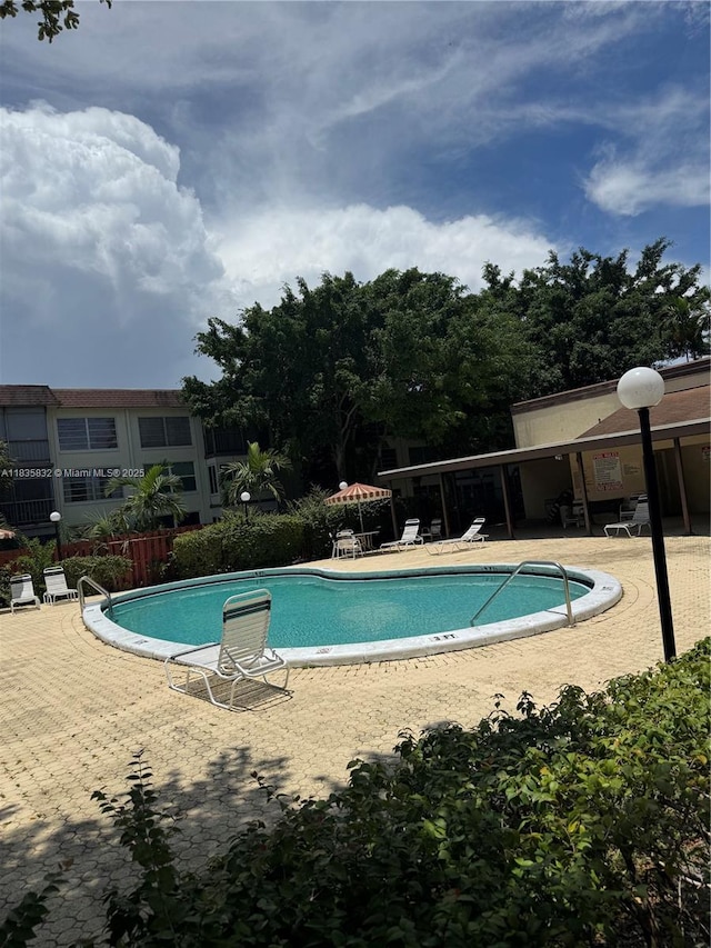 7480 NW 17th St Unit 103, Plantation, FL 33313 - community pool with a patio area