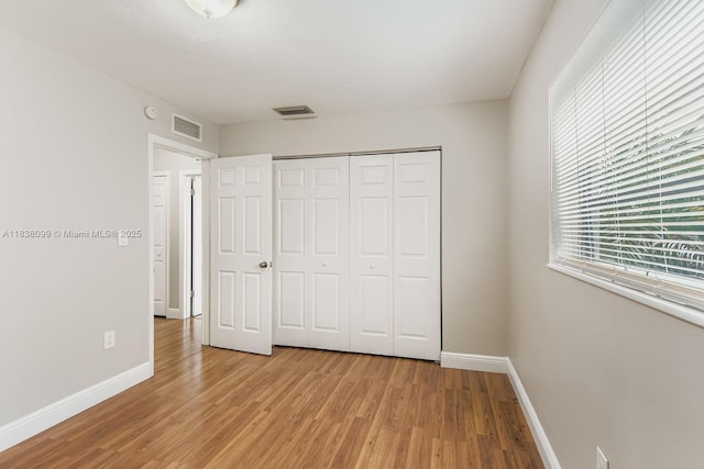 7904 Alhambra Blvd, Miramar, FL 33023 - unfurnished bedroom featuring light wood-type flooring and a closet