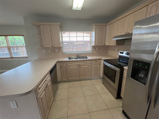 6865 SW 158th Pl, Miami, FL 33193 - kitchen featuring appliances with stainless steel finishes, under cabinet range hood, light countertops, a peninsula, and open shelves