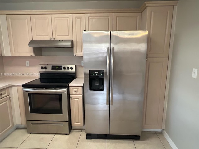 6865 SW 158th Pl, Miami, FL 33193 - kitchen with stainless steel appliances, under cabinet range hood, light countertops, and light tile patterned flooring