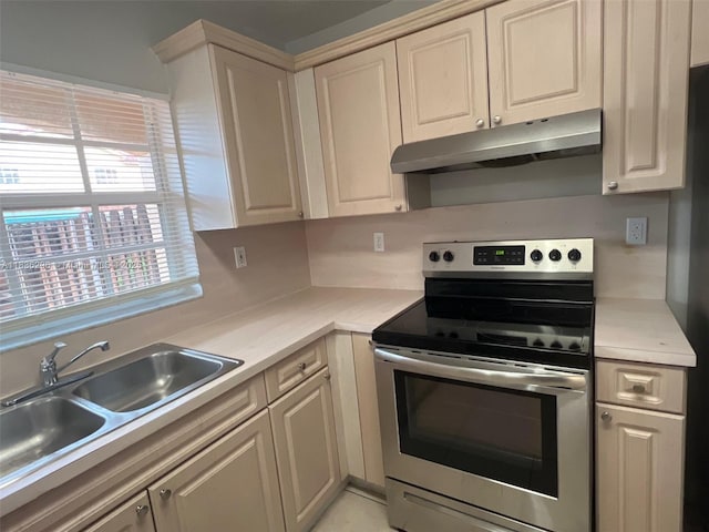 6865 SW 158th Pl, Miami, FL 33193 - kitchen with stainless steel range with electric cooktop, under cabinet range hood, and light countertops