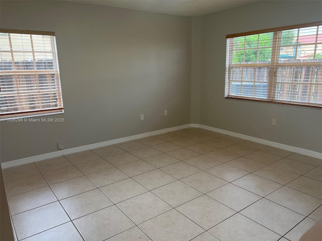 6865 SW 158th Pl, Miami, FL 33193 - unfurnished room with light tile patterned flooring and baseboards