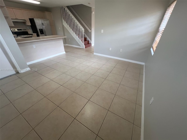 6865 SW 158th Pl, Miami, FL 33193 - unfurnished living room featuring light tile patterned floors and stairs