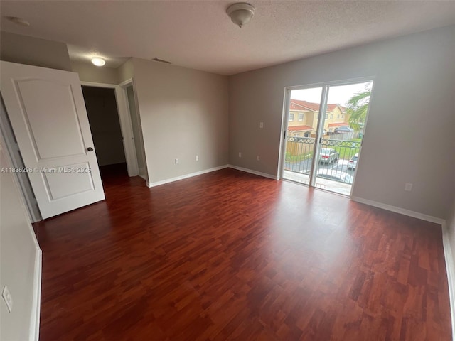 6865 SW 158th Pl, Miami, FL 33193 - unfurnished room with dark wood-style floors and a textured ceiling