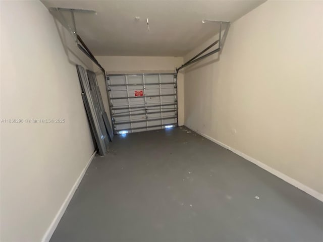 6865 SW 158th Pl, Miami, FL 33193 - garage featuring baseboards